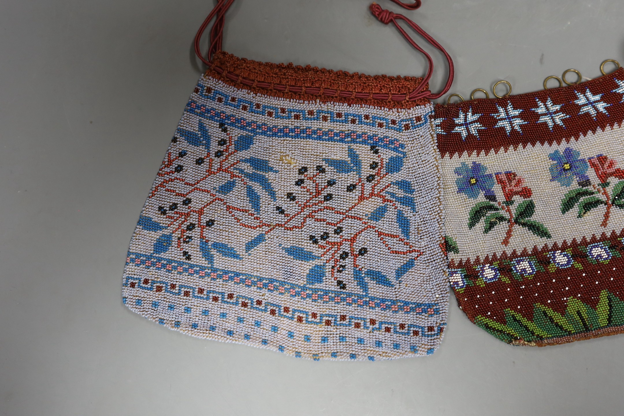 A 19th century bead worked bag with sailing ship design, a similar floral bead worked bag and a 1920’s-30’s abstract bead worked bag
